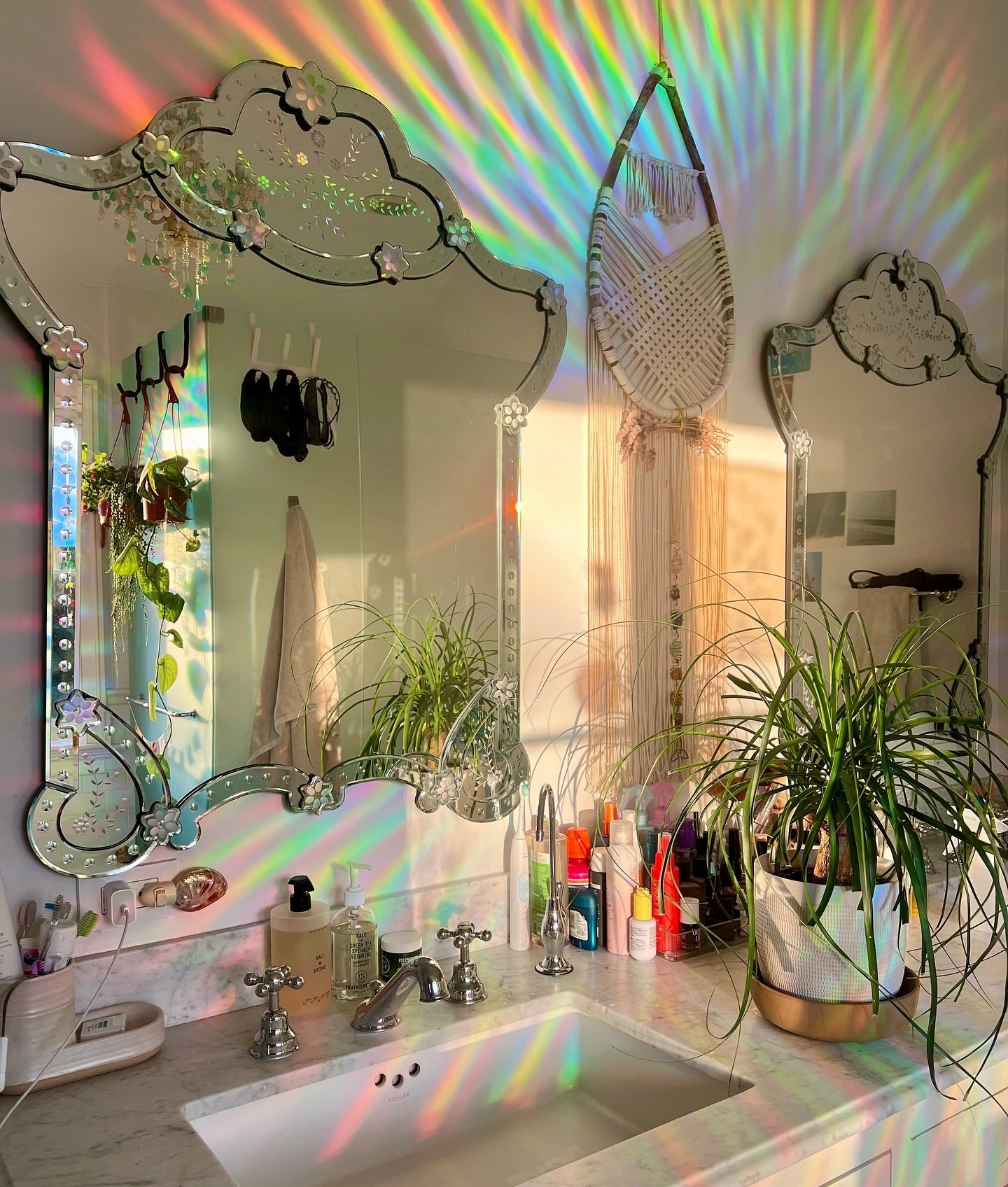 Rainbows thrown across a real room by a Glimmerprism suncatcher in direct sun