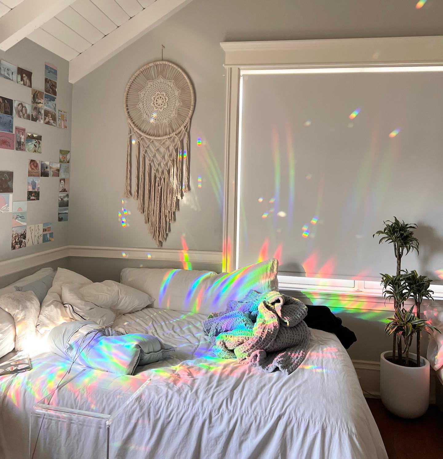 Rainbows thrown across a real room by a Glimmerprism suncatcher in direct sun