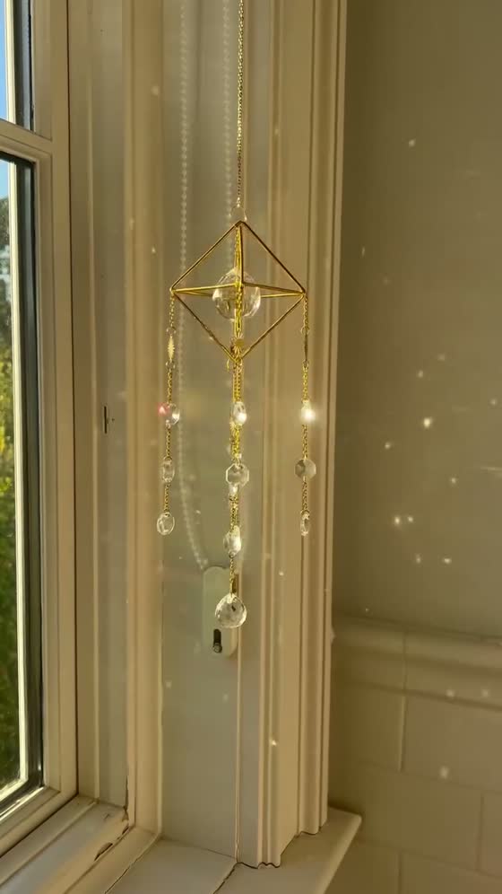 A gold hanging scattering points of light