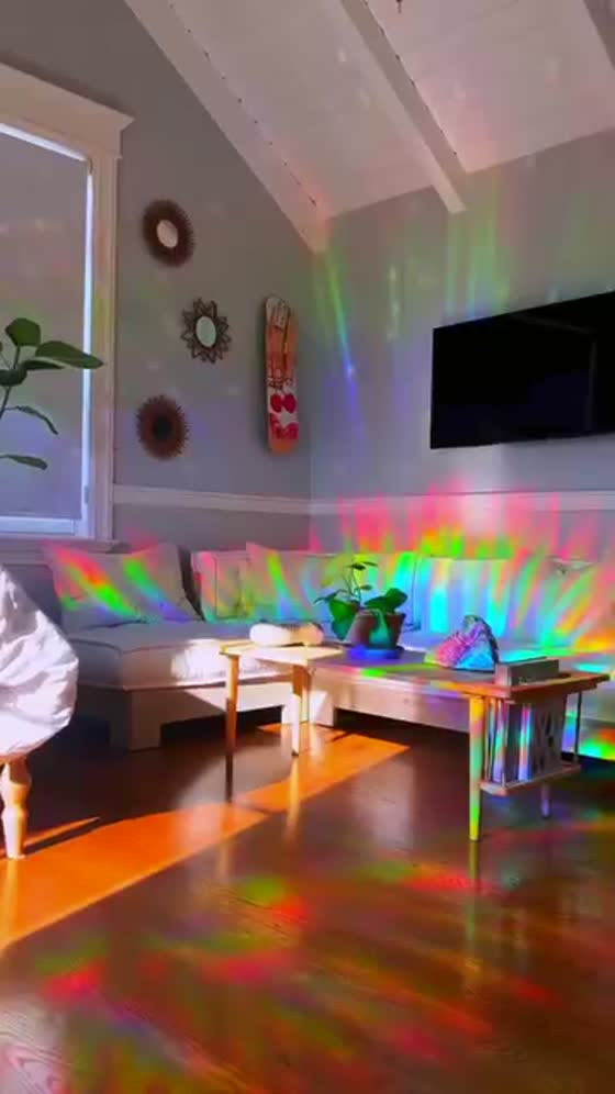 A sofa flooded with drifting rainbows