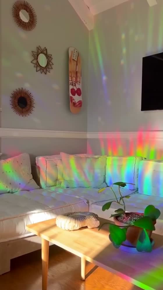 A door wall drenched in a giant rainbow arc