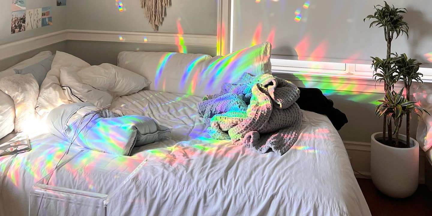 Sunlight through prism film, throwing colour across a real room